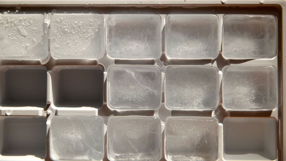 A tray full of ice cubes